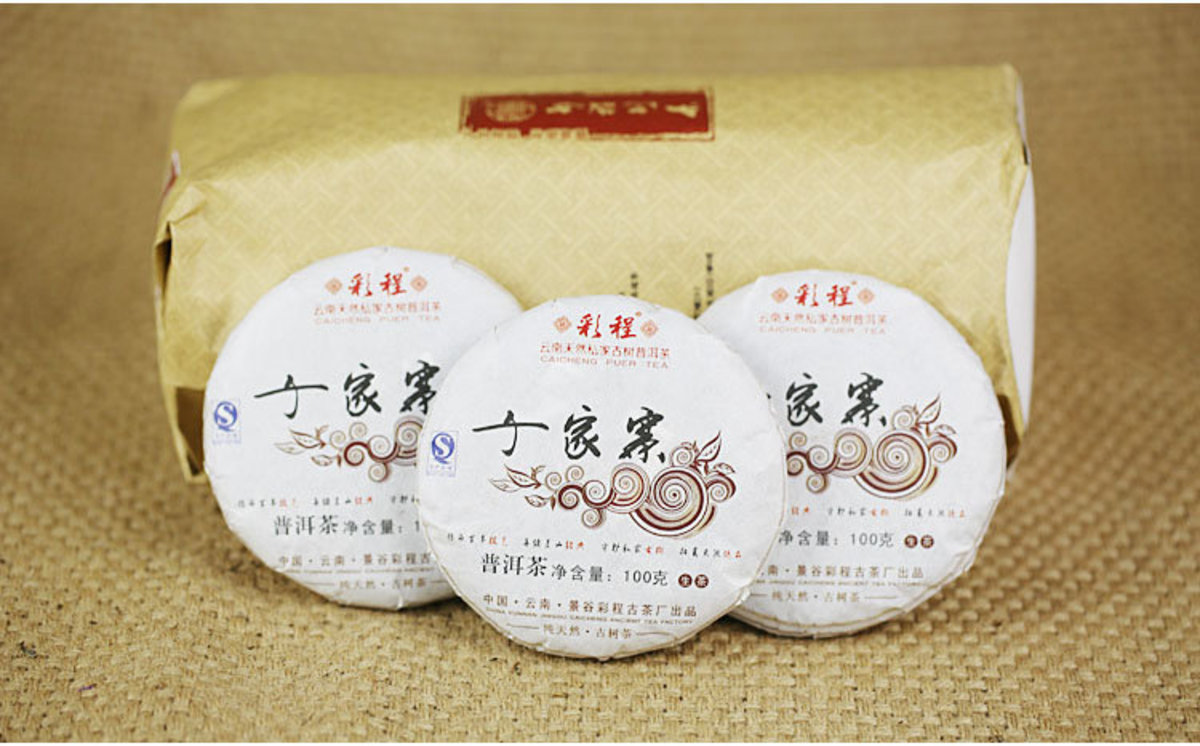 100g cake CaiCheng raw puerh tea QianJiaZhai Year 2013